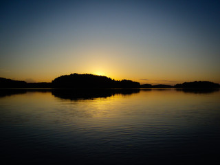 Dark orange Sunset over a finnish lake
