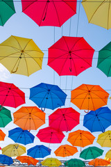 Fototapeta na wymiar multicolored umbrellas in the sky