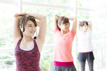 attractive asian women exercising in sports gym