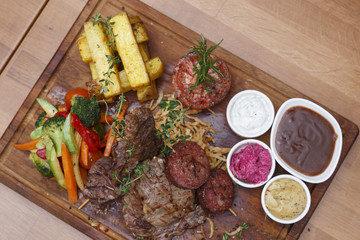 grilled meat, sausage and vegetables