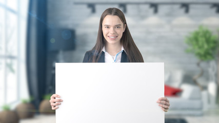 Young beautiful business woman and creative designer standing over blured interior background