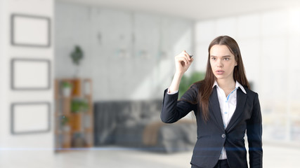 Young beautiful business woman and creative designer standing over blured interior background