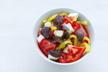 Delicious vegetable salad with feta cheese tomato and pepper