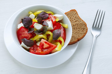 Delicious vegetable salad with feta cheese tomato and pepper