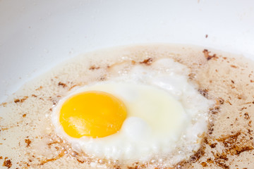 breakfast frying eggs bacon raw cooked stove top