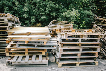 Used worn wooden pallet dumped at the yard.