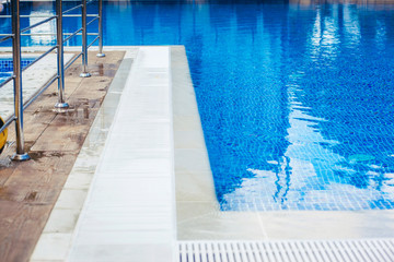 Obraz premium Part of the Pool with turquoise Water, Background.