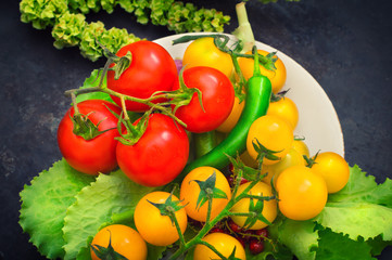 Set organic food. Fresh raw vegetables for salad. On a old blue background. Top view. Close-up