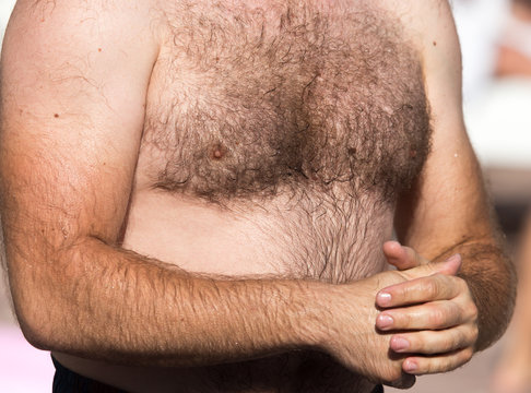 Hairy chest of a man in the open air