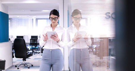 Fototapeta na wymiar Business Woman Using Digital Tablet in front of Office