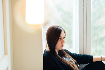 Brunette girl at home, interior