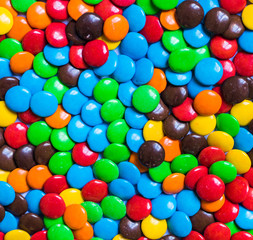 Fototapeta na wymiar Assortment of sweet dessert colorful chocolate candy. Food background pattern
