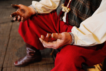 Hands of the Ukrainian Cossack blacksmith close-up. Huge man's hands in fuel oil or mud