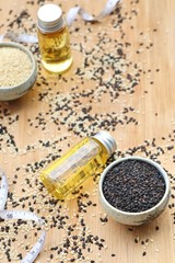 Fototapeta na wymiar Sesame oil with seeds