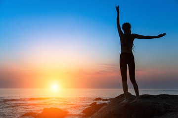 Fototapeta na wymiar Silhouette meditation woman serenity and yoga practicing at sunset.