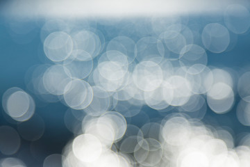 Glare, bokeh from the water. Water texture.