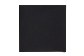 Black color paper sheet on white background used for decoration or design element