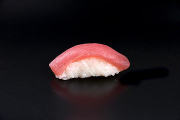 tuna nigiri isolated black background