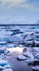 sun light reflecting on iceberg glacier lagoon, jokulsarlon of Iceland