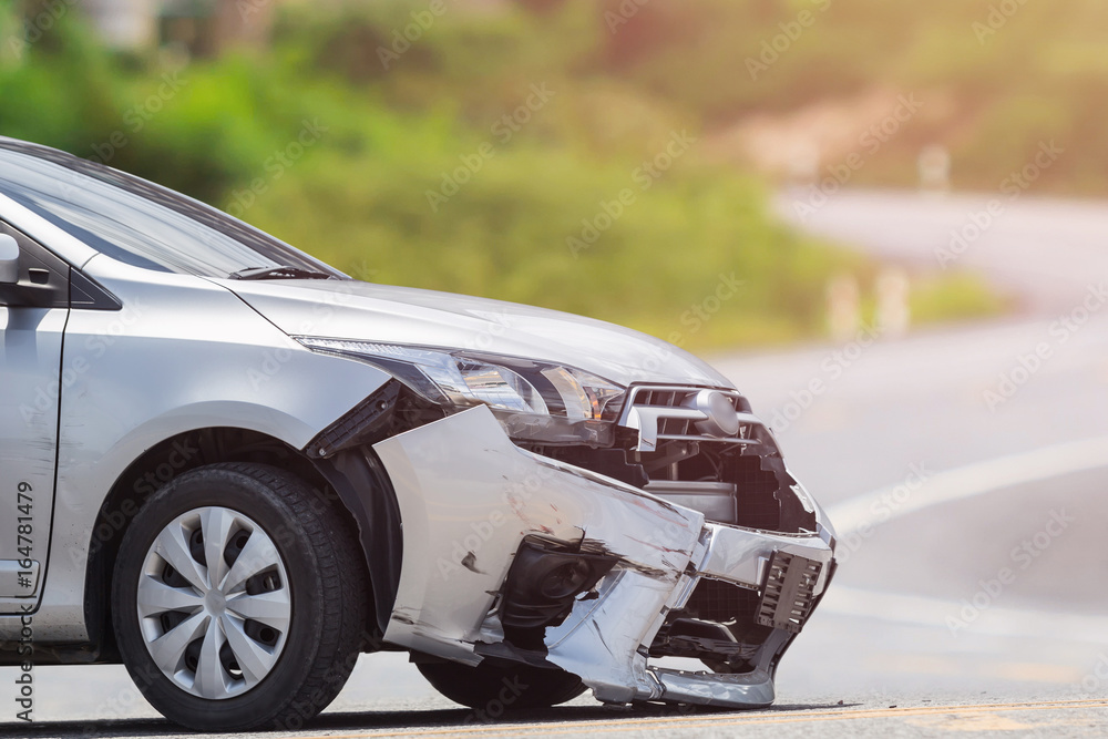 Wall mural Silver car get damaged by crash accident on the road. Car repair or car insurance concept