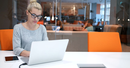businesswoman using a laptop in startup office