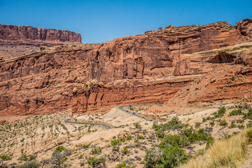 Fototapeta premium Tourist attraction of the USA. Arches National Park. Car trip in the Moab Desert