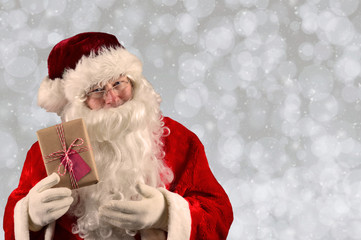 Santa Claus Holding a Christmas Present