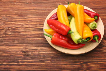 Fresh colored sweet peppers on the plate