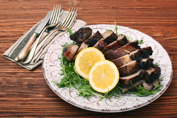 Roast fillet leg of lamb with greens and lemon