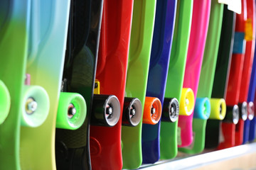 colorful skateboards are sold in the store. bright and vibrant colors. center focus photography

