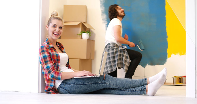 Happy Couple Doing Home Renovations