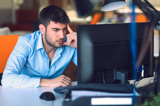 Freelance programmer working in startup office