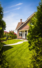 Part of the backyard of a private house on a clear summer day.