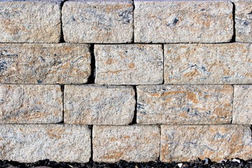 An image of a stone wall in the garden