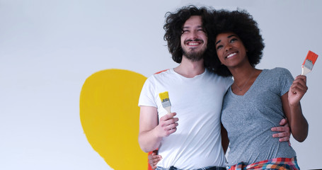 couple with painted heart on wall