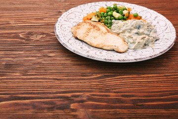 Turkey fillet with mushrooms in cream sauce and vegetables