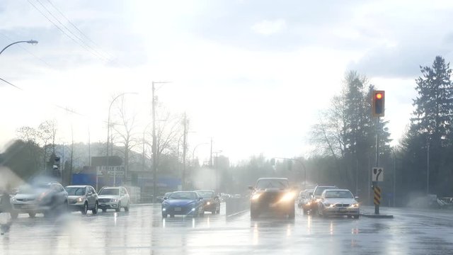 Motion of pedestrian crossing street and traffic flow during heavy raining day 