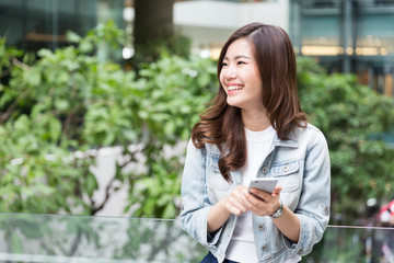 Young asian lady listen to music