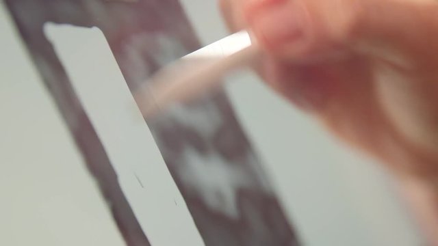 Woman's hand drawing on tablet