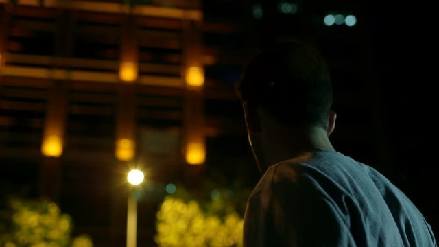 Youth photographs at night