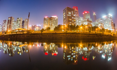 Illuminated City At Waterfront in city of China.