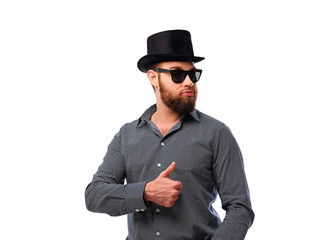 Bearded hipster male in sunglasses and cylinder hat.