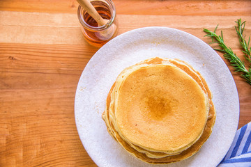Homemade pancakes with honey bee.