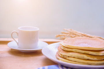 Homemade pancakes with coffee.