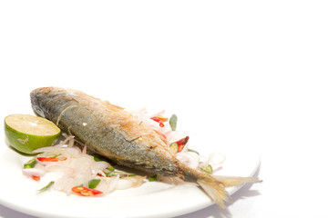 Fried dried salted mackerel fish with flavoring spicy isolated on white