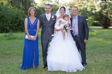 Family Group At Wedding Multi generation couple with parents and little daughter girl