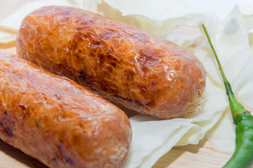smoked grilled sausage on white background