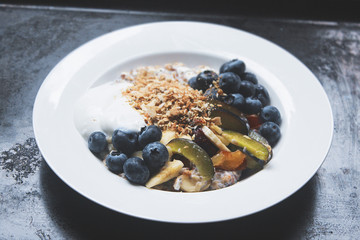 healthy morning breakfast bowl with fresh fruit and granola