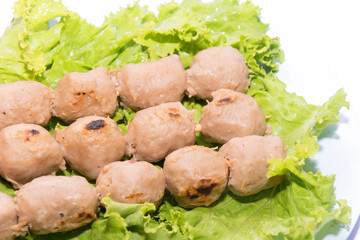 grilled meatball with sauce on white background