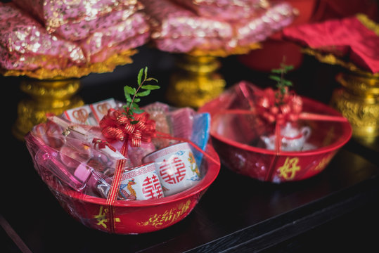 Set of Object meaning lucky in red basket for Thai - Chinese wedding or engagement culture. Foreign Text on this image is Chinese word the meaning is Blessing word